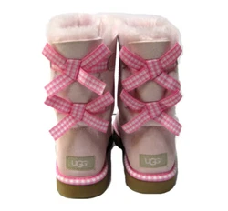 Treadlite by UGG outsole with gingham ribbon welt binding. Two fixed gingham ribbon bows along back shaft. Suede heel...
