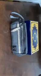 Versace Handbag. Black rare hand bag Excellent material Comes with the boxHas a little compartment on the inside to...