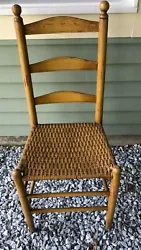 Really solid and pretty mustard painted ladder back chair with woven seat. Take care!
