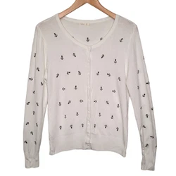 Debut lightweight summer cardigan sweater in white with embroidered black anchors all over. Scoop neck, long sleeve,...