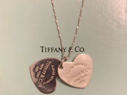 This beautiful necklace from Tiffany & Co. features their iconic double heart design. Crafted from .925 sterling...