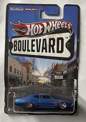HOT WHEELS BOULEVARD 1970 FORD TORINO 70’s UNDERDOGS With REAL RIDERS Wheels.. There is some damage on the card given...
