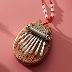 1x Mini Thumb Piano. 1x Ball Bead Wax Cord Chain. Can be hung on key chain or worn around the neck. Super mini, looks...