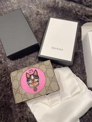 Authentic Gucci mini card case wallet in a stunning print. Red leather on the inside. Gold tone hareware. Foldover flap...