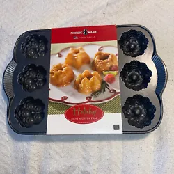 Nordic Ware Holiday Mini Muffin Pan Brand new for sale. Please check pictures and ask any questions. Please ask...