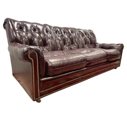 Own the best.  Rarely available vintage Hancock & Moore nailhead chesterfield sofa.Fabric is an cranberry leather and...