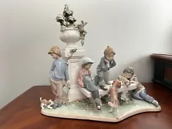 LLADRO #5539 – PUPPY DOG TAILS, Boys in park with Dogs. Overall appears to be complete and In excellent condition....