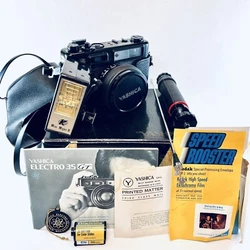 Includes original box with manuals and inserts. Case, Yashinon DX 45mm 1:1.7 lens, Mini-Might II flash, & Yashica ST-7...