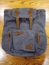 This handsome backpack has never been used.  I cut the tags off and never used it.  It is a rich medium brown durable...
