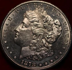 Here we have one 1878-CC Morgan Dollar. This coin has been polished. The coin is in raw uncertified condition and is a...