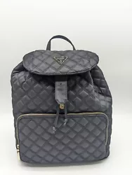 This bag featuressolid color nylon. Guess logo plaque at front ingold. Closure:Drawstring and magnetic snap on flap....