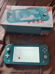 Nintendo Switch Lite Console Portable - Turquoise. Pour réparateur uniquement en létat car elle ne lit plus les jeux...