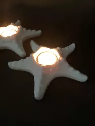 Set of two (2). White bisque. Starfish Tea Light Holders. Very nice preowned condition. Pretty for a beach lover! I do...