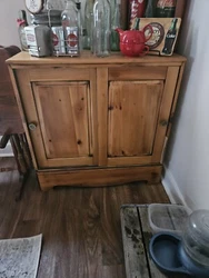 Wooden kitchen cabinet  w shelf and slide doors.  Originally had as microwave stand then became snack cabinet