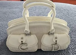 This beautiful Christian Dior handbag from France is the perfect addition to any womans collection. With a petite yet...