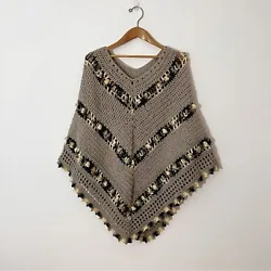 Beautiful Hand Crochet Bohemian Style Poncho. The base color is Taupe. The accents are in gold, cream, pewter and slate...