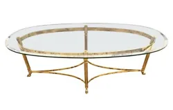 Magnificent oval Maison Jansen mid century modern cocktail table with signature hoof feet. Iconic mid century lines.