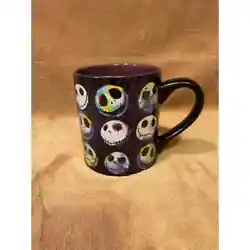 Mug is black with purple sparkle cobwebs outside and a deep purple inside, features, Disneys beloved character many...