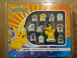 Coffret 11 Fèves Pokémon. Dont 1 Pikachu exclusif.  Boîte plastique cassé mais boîte carton contenant les fèves...