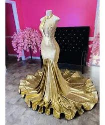 gold prom dress size 2. This dress is new and in perfect condition.