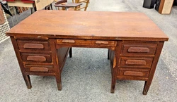 Double pedestal style with six drawers. Bottom drawer on the right is double file drawer and one is the center drawer....