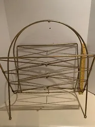 Vintage Mid Century Modern Metal Magazine Rack. Measures roughly 20 x 11 inches. Shipping is to continental 48 states....