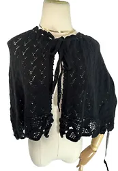 Elevate your style with this elegant black shawl wrap from April Cornell Boutique. Made from a luxurious blend of...