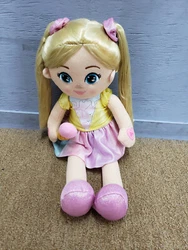 Blonde hair, embroidered facial features, yellow top with ice cream cone front, pink rainbow skirt, ice cream cone...