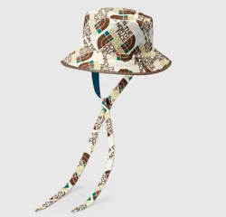 The North Face x Gucci self tie nylon hat. Ivory regenerated and recycled nylon fabric with The North Face logo x Gucci...