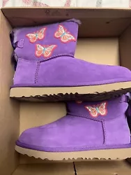 UGG Australia Boots Kids 4 NEW Mini Bailey Bow II Butterfly DWB Purple NIB. Condition is New with box. Shipped with...