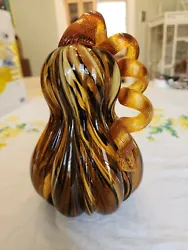 Beautiful hand blown glass pumpkin. Stands about 8.5 inches in height and weighs more than 2.5 pounds. No chips or...