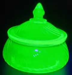 Beautiful uranium glass lidded candy dish by Anchor Hocking. Has a spiral look to the glass.