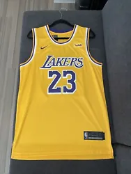 This jersey is not an authentic Nike jersey. This is a replica. Please bid accordingly. The yellow jersey, size 50...