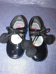 CHILDRENS GIRLS MARY JANE SHOES WITH LITTLE POM POMS AND BOWS. MARY JANE STYLE. • MARY JANE. BLACK PATENT LEATHER....