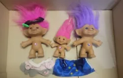 This lot of 3 ACE Novelty Treasure Trolls dolls includes a wishstone belly gem doll with red, pink, and green hair in a...