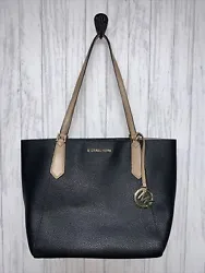 This Michael Kors Kimberly Small Signature Tote Bag is an excellent addition to any wardrobe. It features a black,...