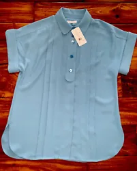 This Equipment blouse in beautiful Niagara blue is a must-have for any wardrobe. With short cuffed sleeves and a...