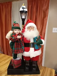 Vintage 1993 Holiday Creations Animated Santa With Girl & lighted Lamp Post. Motionette is pre-owned but in great...