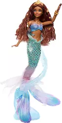 Ariel also wears golden jewelry throughout, including a removable golden bracelet. Ariel’s translucent doll stand...