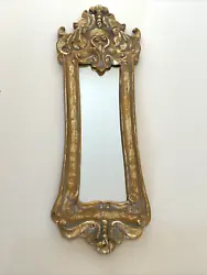 A vintage gold gilt wall mirror that measures just over 17x6