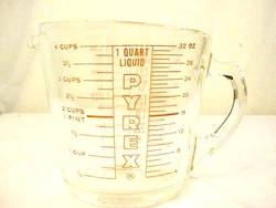Clear glass with bright red print and minimal fading. Pyrex is printed under the spout on both sides. Photo color may...