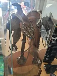 Legends art sculpture Center Fire saddle with display case.145/350. Some scratches in wood base from moving.