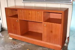 Mahogany credenza owned by my parents; bought in the 1950s.  Made of solid mahogany and mahogany plywood.  Works as a...