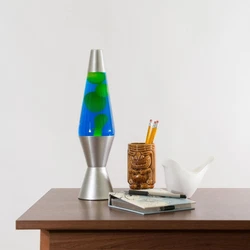 This Lava Lite 2124 features yellowy green lava that oozes around in bright turquoise fluid. When the lava wax gets hot...