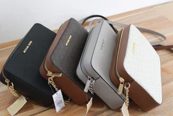Gorgeous durable PVC MK monogram with leather trim. Water & stain resistant. Adjustable long leather strap with gold...