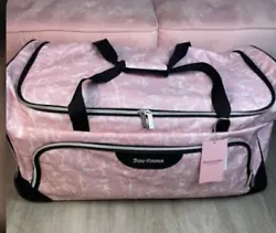 Get ready to travel in style with this stunning Juicy Couture rolling duffel bag. The beautiful pink marble design will...