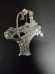 Vintage Silver Tone Flower Basket Pin. Flowers and bow are accented with red and green rhinestones. No obvious markings