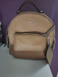 Guess Backpack with card wallet. Previously owned by one owner very small flaws shown in picture. Well taking care of....