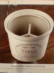 The exterior of the box shows wear. - On the side of the box it says 8” Dia., 7”H - High quality glazed stoneware...