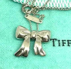 TIFFANY & Co. Mini Ribbon Bow Sterling Silver 925 Necklace Pendant Used. Item cannot be used as-is. Repair needed or...